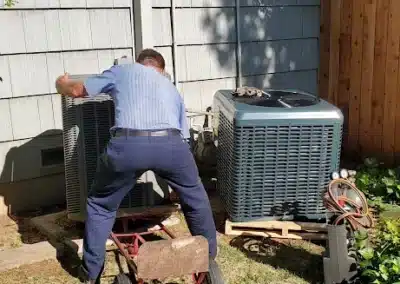 Heald Mechanical technician diagnosing an outdoor air conditioning system in Sacramento, CA.